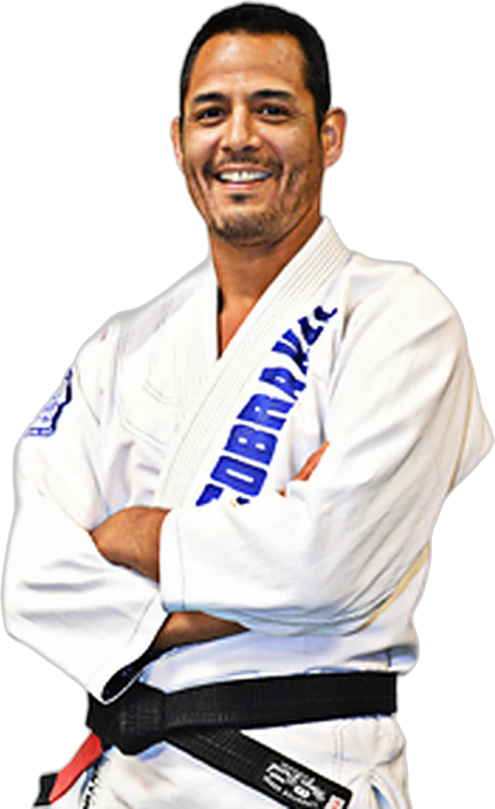 Dave Bazan in a white gi with a 3rd-degree black belt